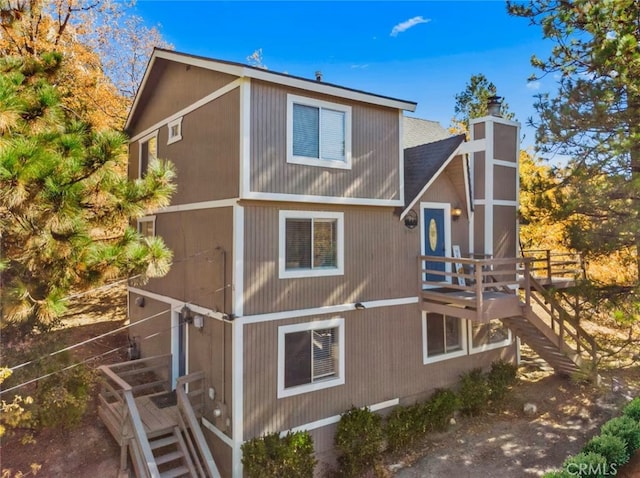 27638 St Bernard Ln, Lake Arrowhead, CA 92352 - view of side of home with a chimney and a shingled roof
