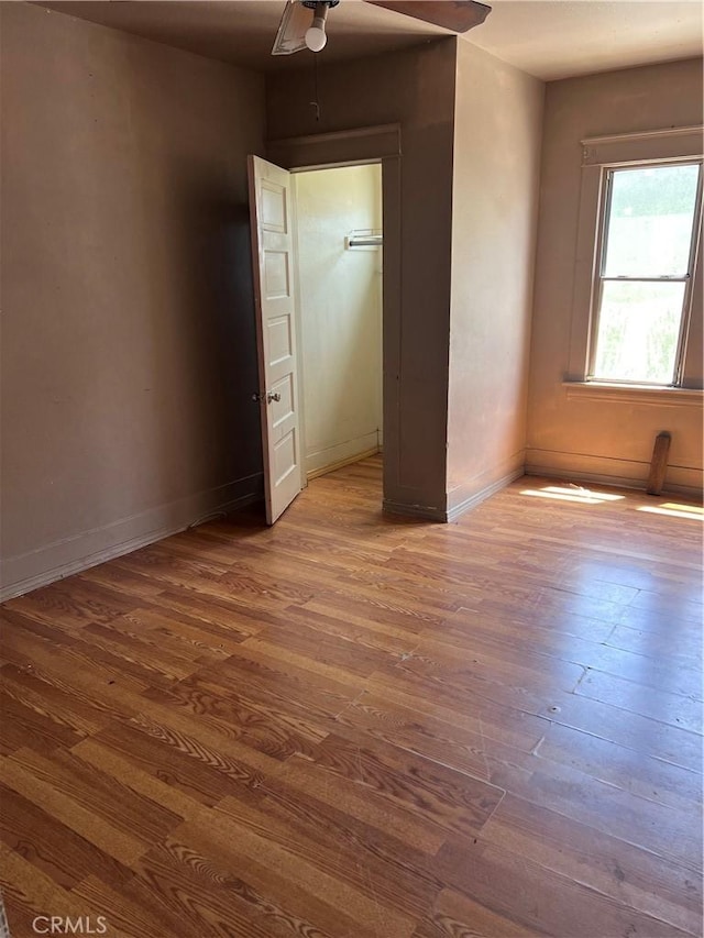 1909 E 59th St, Long Beach, CA 90805 - unfurnished bedroom with hardwood / wood-style floors and ceiling fan