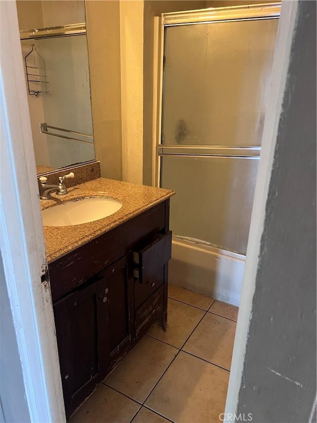 1909 E 59th St, Long Beach, CA 90805 - full bathroom featuring tile patterned floors, vanity, and shower / bath combination with glass door