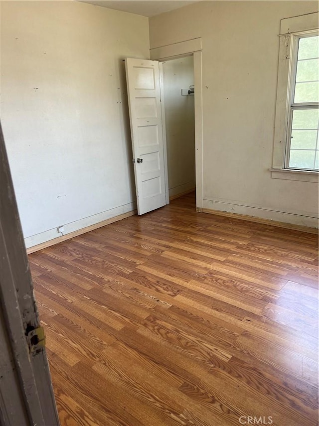 1909 E 59th St, Long Beach, CA 90805 - empty room featuring wood finished floors and baseboards
