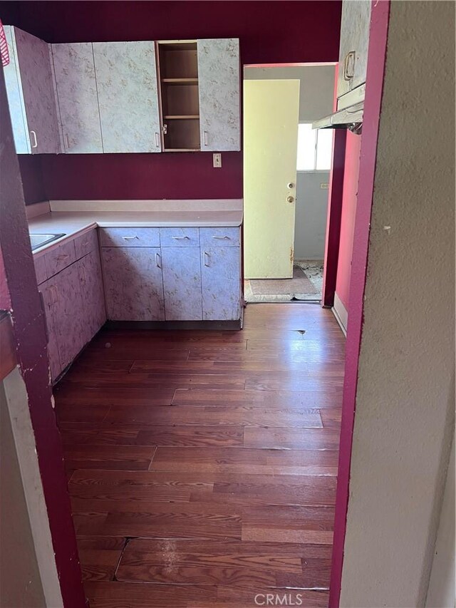 1909 E 59th St, Long Beach, CA 90805 - kitchen featuring dark wood finished floors, light countertops, and open shelves