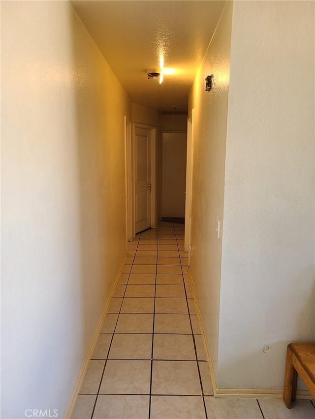14680 Upland Ave, Fontana, CA 92335 - corridor with light tile patterned floors and baseboards