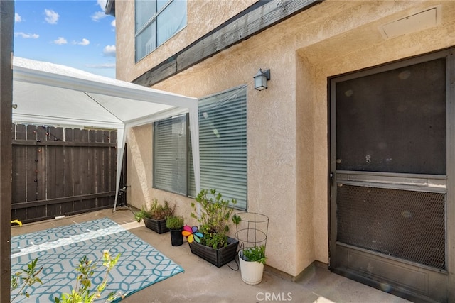 5463 Newcastle Ave Unit 8, Encino, CA 91316 - view of exterior entry with a patio area and stucco siding