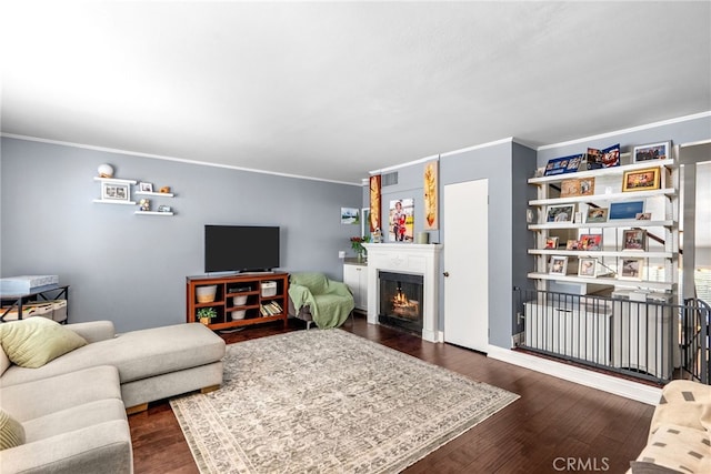 5463 Newcastle Ave Unit 8, Encino, CA 91316 - living area with ornamental molding, dark wood-style flooring, and a lit fireplace