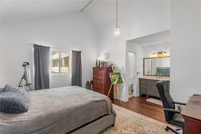 5463 Newcastle Ave Unit 8, Encino, CA 91316 - bedroom featuring high vaulted ceiling, wood finished floors, beamed ceiling, and a desk