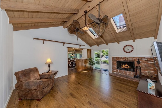 18269 Laurel View Dr, Yorba Linda, CA 92886 - living room featuring a skylight, a wood ceiling with exposed beams, dark wood-type flooring, a brick fireplace, and a ceiling fan