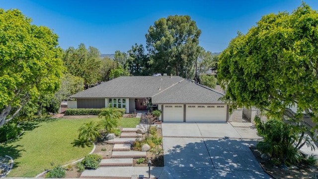 18269 Laurel View Dr, Yorba Linda, CA 92886 - ranch-style home with an attached garage, driveway, a front yard, and roof with shingles