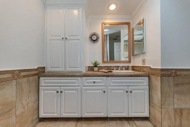 18269 Laurel View Dr, Yorba Linda, CA 92886 - bathroom featuring tile walls, double vanity, crown molding, and wainscoting
