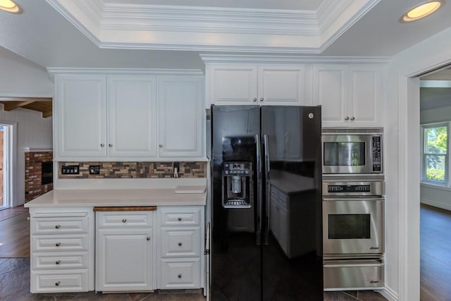 18269 Laurel View Dr, Yorba Linda, CA 92886 - kitchen with appliances with stainless steel finishes, ornamental molding, white cabinets, a warming drawer, and a tray ceiling