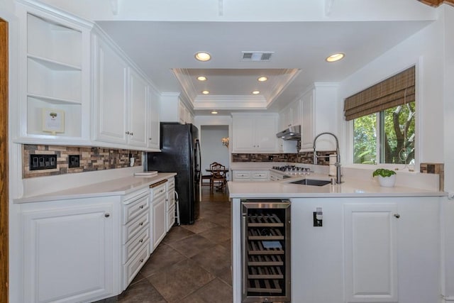 18269 Laurel View Dr, Yorba Linda, CA 92886 - kitchen featuring wine cooler, freestanding refrigerator, under cabinet range hood, white cabinets, and open shelves