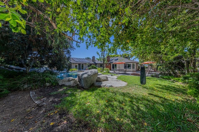 18269 Laurel View Dr, Yorba Linda, CA 92886 - view of green lawn with a patio area and an outdoor pool