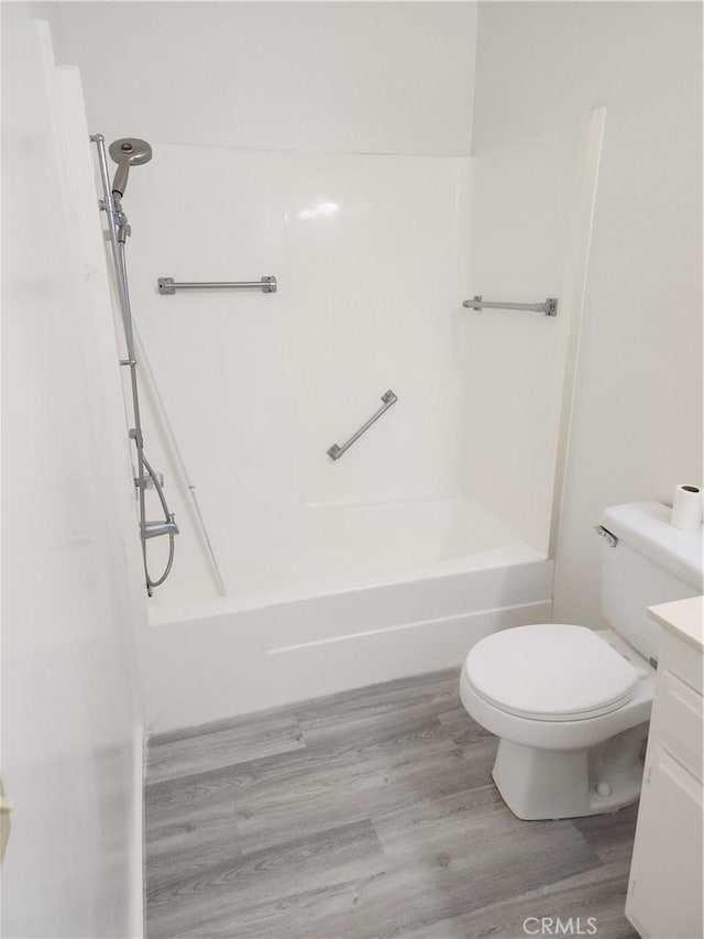 2119 Via Puerta Unit Q, Laguna Woods, CA 92637 - bathroom with toilet, shower / washtub combination, vanity, and wood finished floors