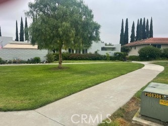 2119 Via Puerta Unit Q, Laguna Woods, CA 92637 - view of property's community with a lawn