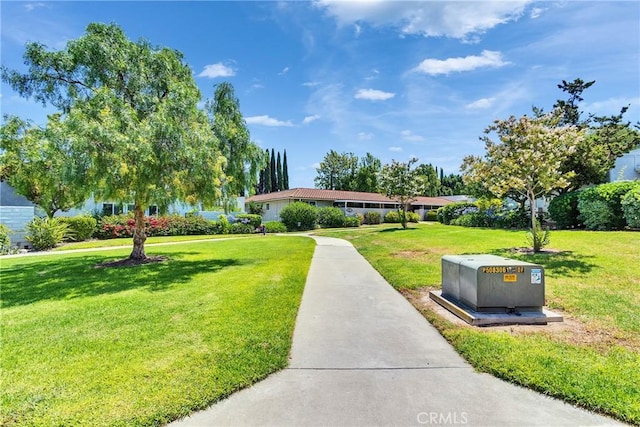 2119 Via Puerta Unit Q, Laguna Woods, CA 92637 - view of front facade featuring a front lawn