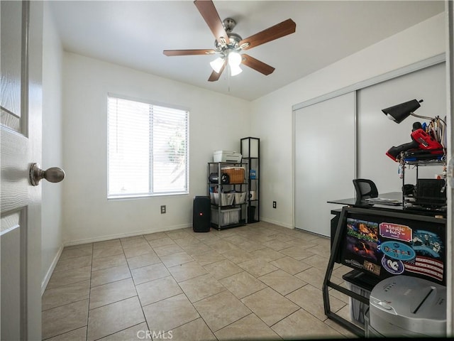 1173 Conestoga St, Corona, CA 92881 - home office with a ceiling fan, light tile patterned flooring, and baseboards
