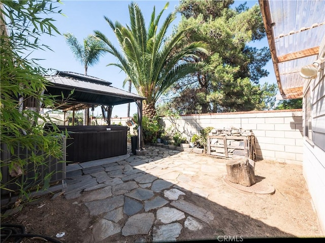 1173 Conestoga St, Corona, CA 92881 - fenced backyard featuring a hot tub, a patio area, and a gazebo