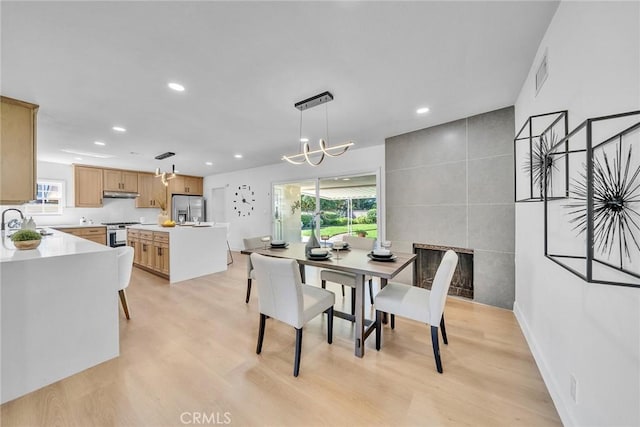 1321 S 8th Ave, Arcadia, CA 91006 - dining space featuring recessed lighting, healthy amount of natural light, light wood-style floors, tile walls, and a chandelier