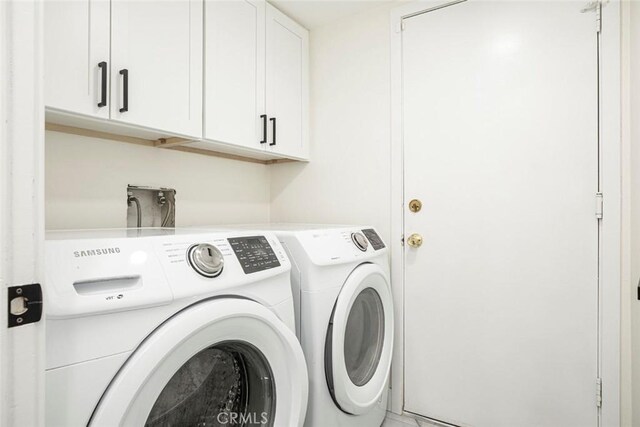 20128 Cavern Ct, Saugus, CA 91390 - laundry room with cabinet space and washing machine and dryer