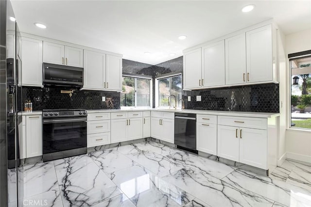 20128 Cavern Ct, Saugus, CA 91390 - kitchen featuring black appliances, recessed lighting, light marble finish floors, tasteful backsplash, and white cabinets