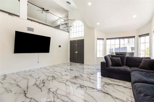 20128 Cavern Ct, Saugus, CA 91390 - living room featuring marble tiled floors, baseboards, recessed lighting, and high vaulted ceiling