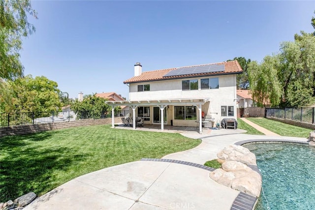 20128 Cavern Ct, Saugus, CA 91390 - back of property featuring roof mounted solar panels, a chimney, a pergola, a patio, and stucco siding
