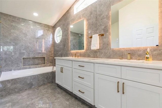 20128 Cavern Ct, Saugus, CA 91390 - bathroom with tile walls, double vanity, marble finish flooring, and lofted ceiling