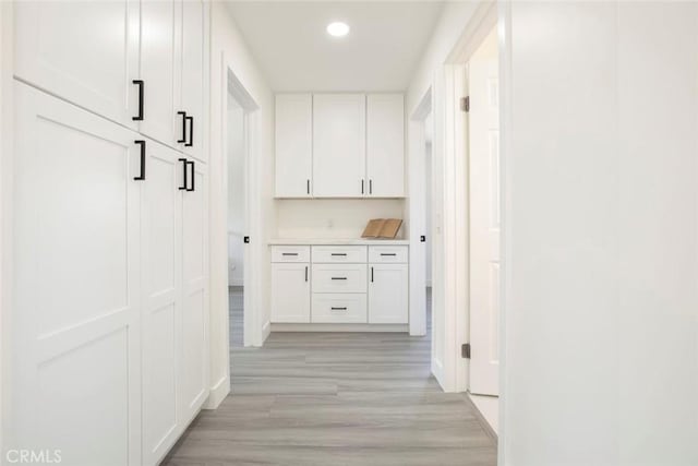 20128 Cavern Ct, Saugus, CA 91390 - hallway featuring light wood finished floors, recessed lighting, and baseboards