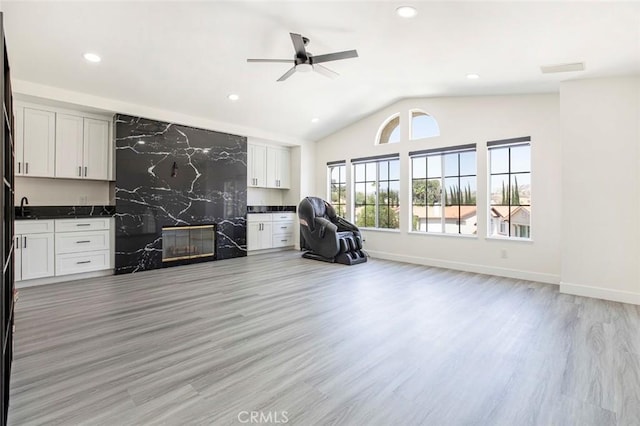 20128 Cavern Ct, Saugus, CA 91390 - living area with lofted ceiling, light wood-style flooring, ceiling fan, a high end fireplace, and recessed lighting