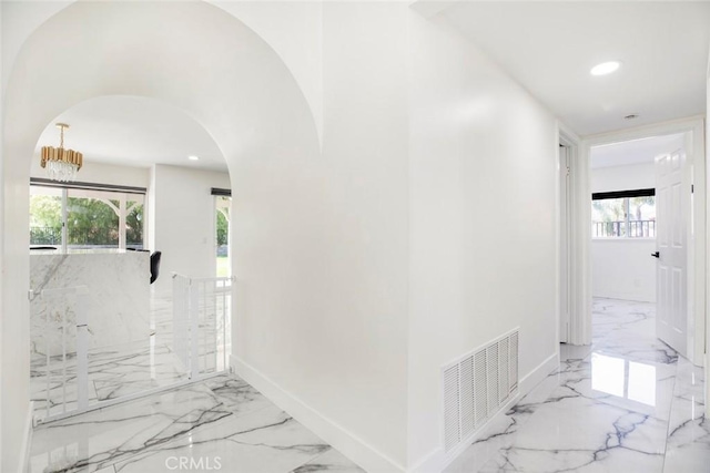 20128 Cavern Ct, Saugus, CA 91390 - hall with marble tiled flooring, arched walkways, healthy amount of natural light, and recessed lighting