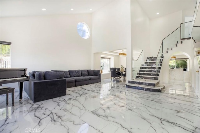 20128 Cavern Ct, Saugus, CA 91390 - living area with stairway, marble tiled flooring, a towering ceiling, and recessed lighting