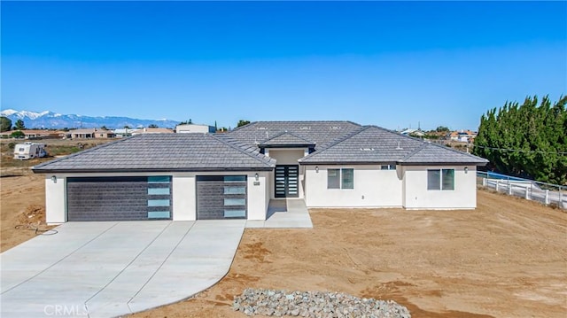 15658 Wells Fargo St, Hesperia, CA 92345 - view of front of property featuring stucco siding, a tile roof, and a mountain view