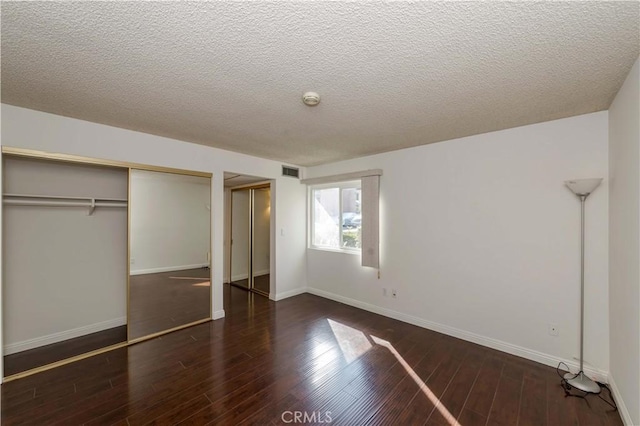 2408 S Hacienda Blvd Unit K2, Hacienda Heights, CA 91745 - unfurnished bedroom featuring a closet, wood finished floors, a textured ceiling, and baseboards