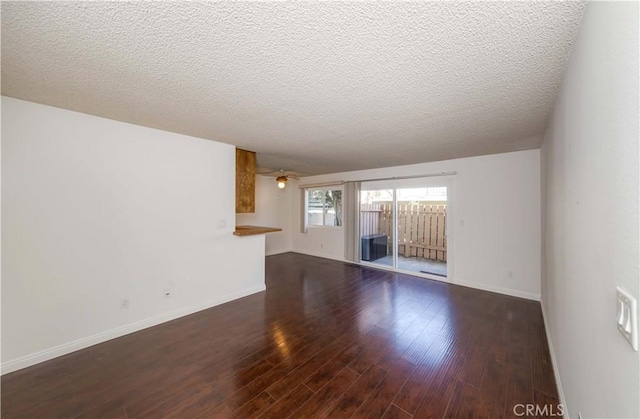 2408 S Hacienda Blvd Unit K2, Hacienda Heights, CA 91745 - unfurnished living room with wood finished floors, baseboards, and a textured ceiling