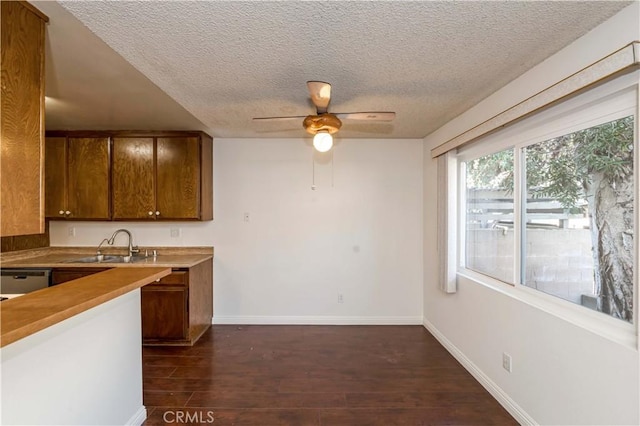 2408 S Hacienda Blvd Unit K2, Hacienda Heights, CA 91745 - kitchen with a textured ceiling, a sink, a ceiling fan, dark wood finished floors, and baseboards