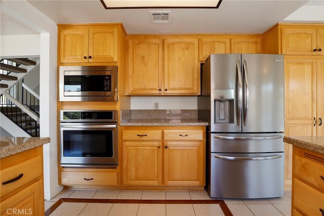 3016 Daphney Ct, Simi Valley, CA 93063 - kitchen with appliances with stainless steel finishes, light tile patterned floors, and light stone countertops