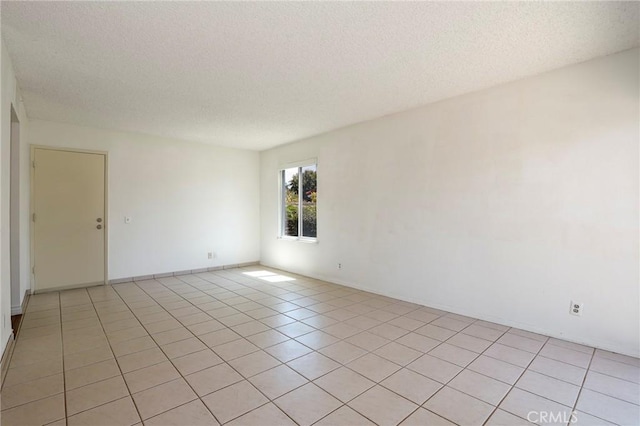 3016 Daphney Ct, Simi Valley, CA 93063 - empty room with a textured ceiling and light tile patterned floors