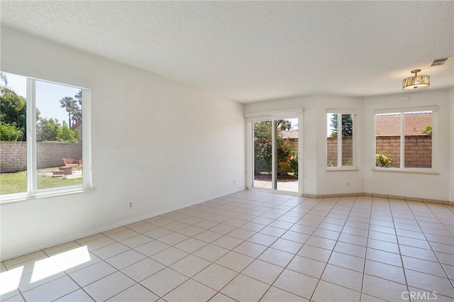3016 Daphney Ct, Simi Valley, CA 93063 - unfurnished room with a textured ceiling and light tile patterned floors