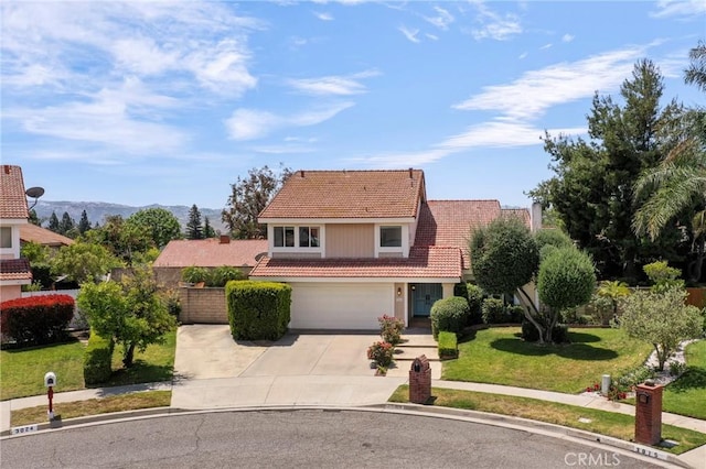 3016 Daphney Ct, Simi Valley, CA 93063 - traditional home with a tile roof, concrete driveway, a garage, a front lawn, and a mountain view