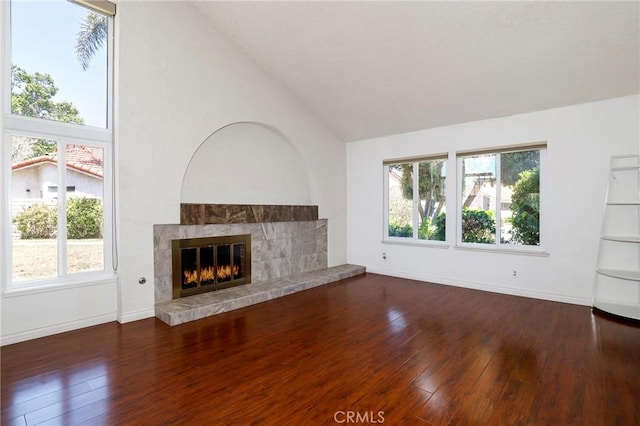 3016 Daphney Ct, Simi Valley, CA 93063 - unfurnished living room featuring a tiled fireplace, plenty of natural light, dark wood-type flooring, and high vaulted ceiling