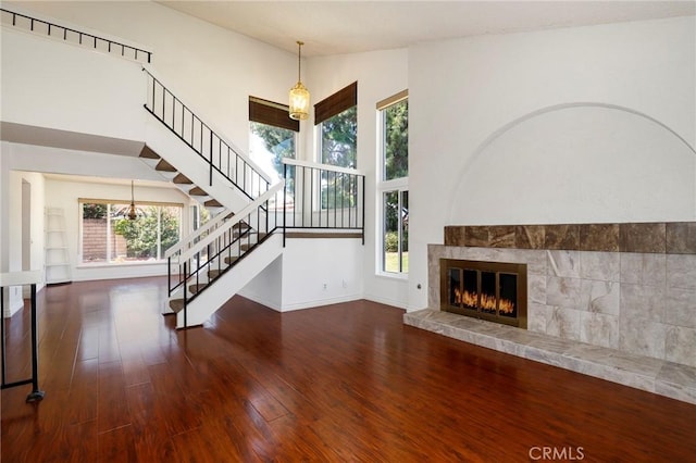3016 Daphney Ct, Simi Valley, CA 93063 - unfurnished living room featuring stairs, plenty of natural light, and wood finished floors