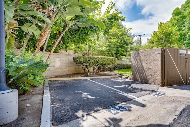 4201 W 5th St Unit 218, Santa Ana, CA 92703 - uncovered parking lot with a gate