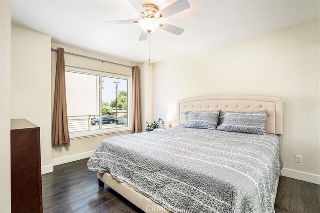 4201 W 5th St Unit 218, Santa Ana, CA 92703 - bedroom featuring baseboards, wood finished floors, and ceiling fan