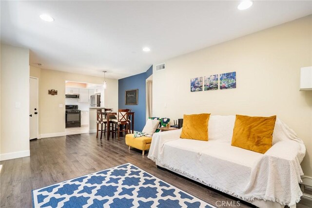 4201 W 5th St Unit 218, Santa Ana, CA 92703 - living room featuring wood finished floors, recessed lighting, and baseboards