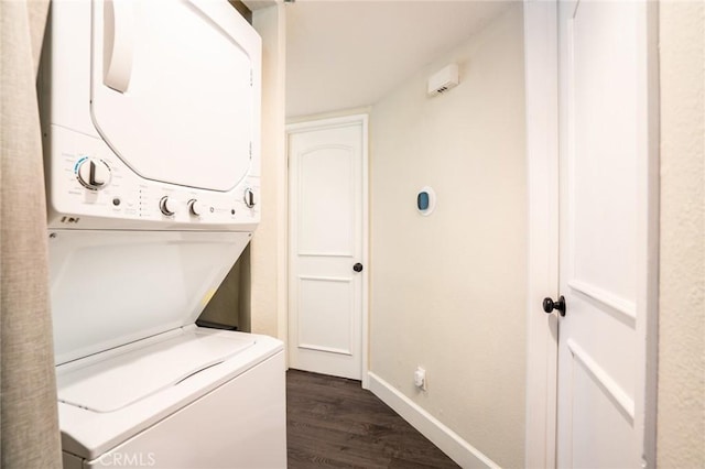 4201 W 5th St Unit 218, Santa Ana, CA 92703 - washroom featuring stacked washer / drying machine, dark wood-type flooring, and baseboards
