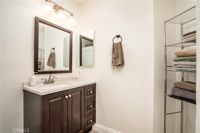 4201 W 5th St Unit 218, Santa Ana, CA 92703 - bathroom with vanity and baseboards