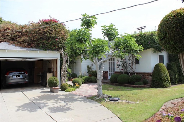 10941 Peach Grove St, North Hollywood, CA 91601 - view of front of home with driveway, a front yard, and brick siding