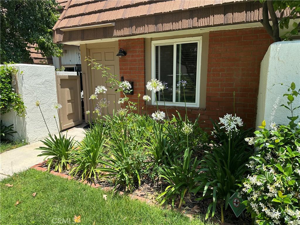 22161 James Alan Cir, Chatsworth, CA 91311 - view of exterior entry featuring brick siding