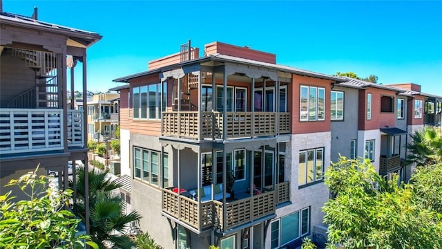 1207 Doheny Way, Dana Point, CA 92629 - back of property featuring a balcony, stucco siding, and a chimney