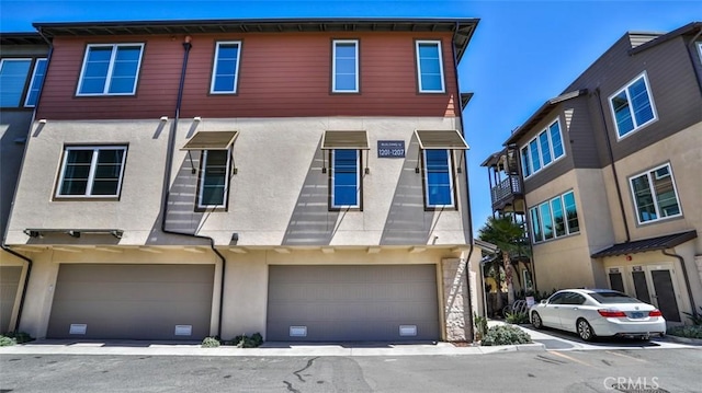 1207 Doheny Way, Dana Point, CA 92629 - view of front of home with stucco siding and a garage