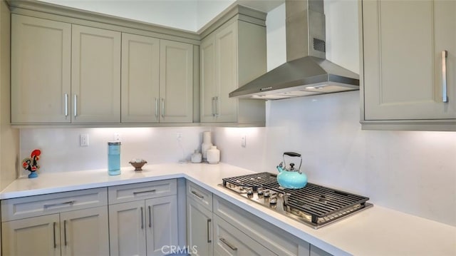 1207 Doheny Way, Dana Point, CA 92629 - kitchen with wall chimney range hood, stainless steel gas stovetop, light countertops, and backsplash
